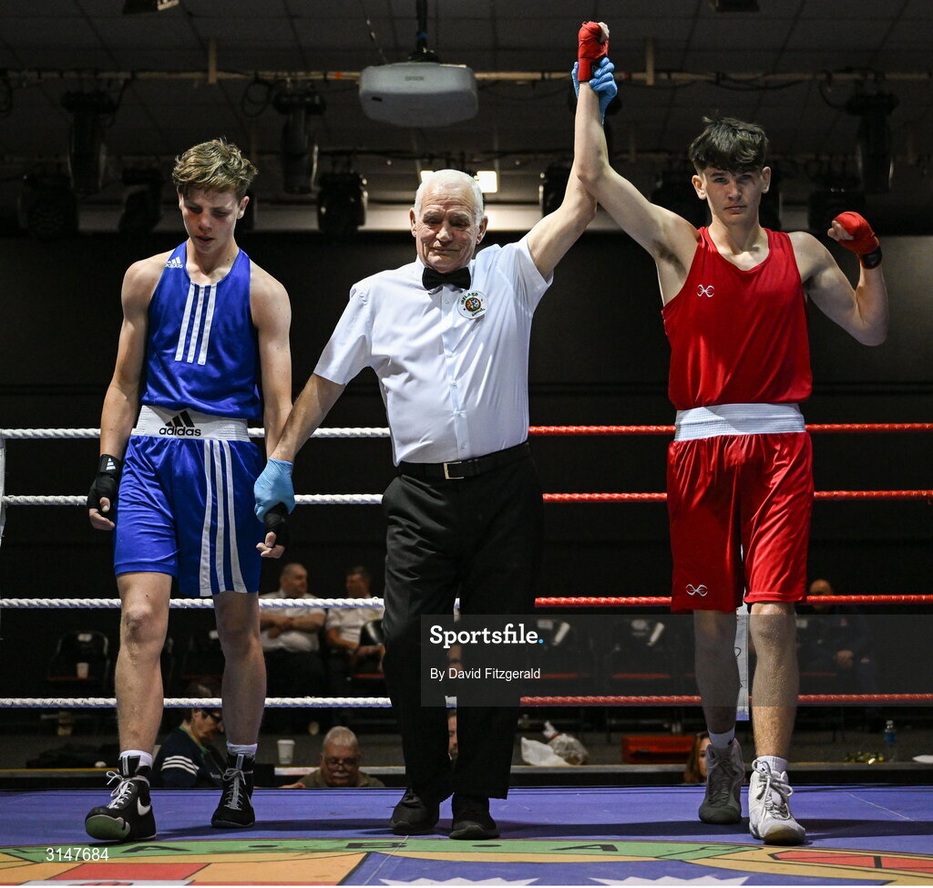 30 May 2025; Jason Donoghue of Olympic L, right, celebrates after winning his bout against Kian O’Sullivan of Conamara BC during the 2025 National Senior Cadet Championship Finals at the National Boxing Stadium in Dublin. Photo by David Fitzgerald/Sportsfile