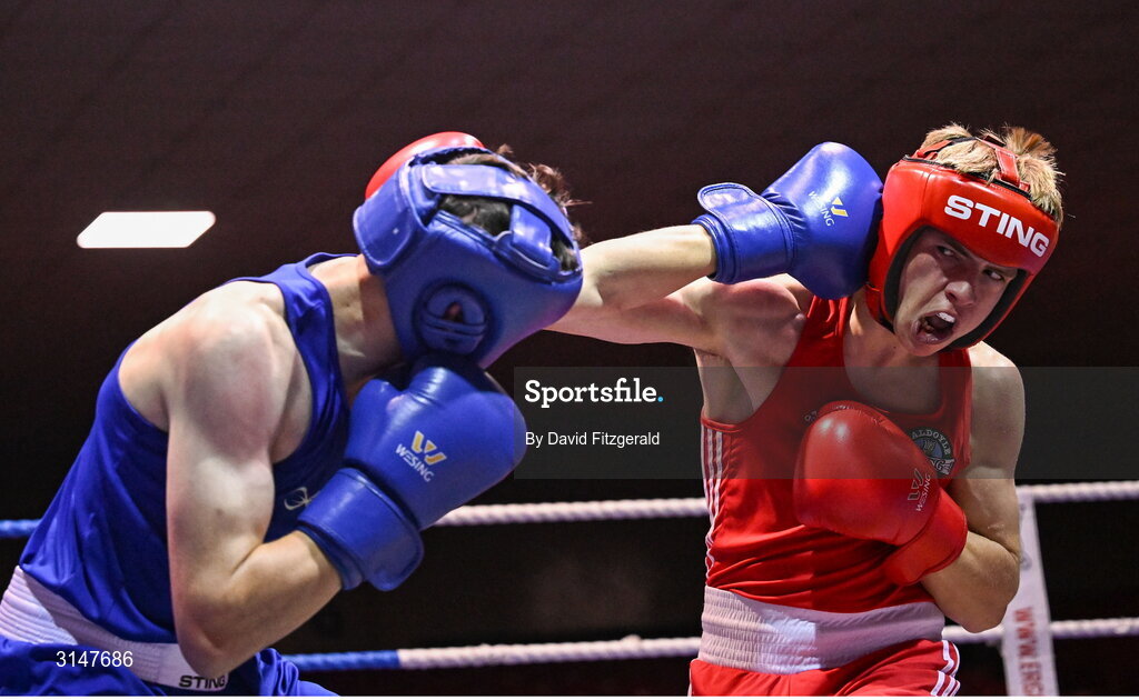 30 May 2025; Phoenix Kenny of Baldoyle BC, right, in action against Lorcan Holohan of Portlaoise BC during their bout at the 2025 National Senior Cadet Championship Finals at the National Boxing Stadium in Dublin. Photo by David Fitzgerald/Sportsfile