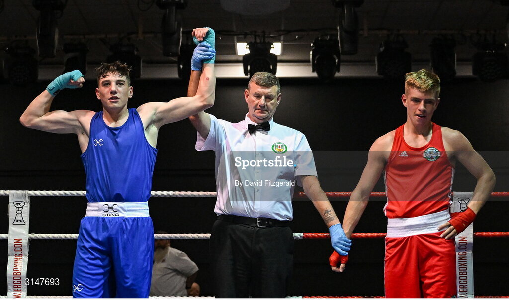 30 May 2025; Lorcan Holohan of Portlaoise BC, left, celebrates after winning his bout against Phoenix Kenny of Baldoyle BC during the 2025 National Senior Cadet Championship Finals at the National Boxing Stadium in Dublin. Photo by David Fitzgerald/Sportsfile