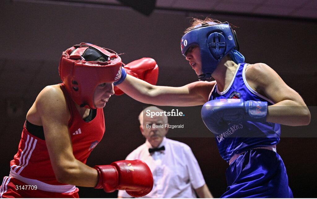 30 May 2025; Ella Leonard of Monivea BC, left, in action against Alesha Mullis Boyle of Dungloe BC during their bout at the 2025 National Senior Cadet Championship Finals at the National Boxing Stadium in Dublin. Photo by David Fitzgerald/Sportsfile