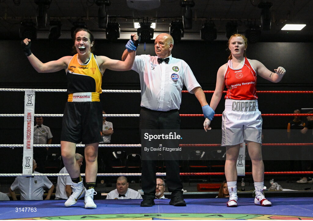 30 May 2025; Cassie Henderson of Phoenix BC, left, celebrates after winning her bout against Kaysie Joyce of Clonmel BC during the 2025 National Senior Cadet Championship Finals at the National Boxing Stadium in Dublin. Photo by David Fitzgerald/Sportsfile
