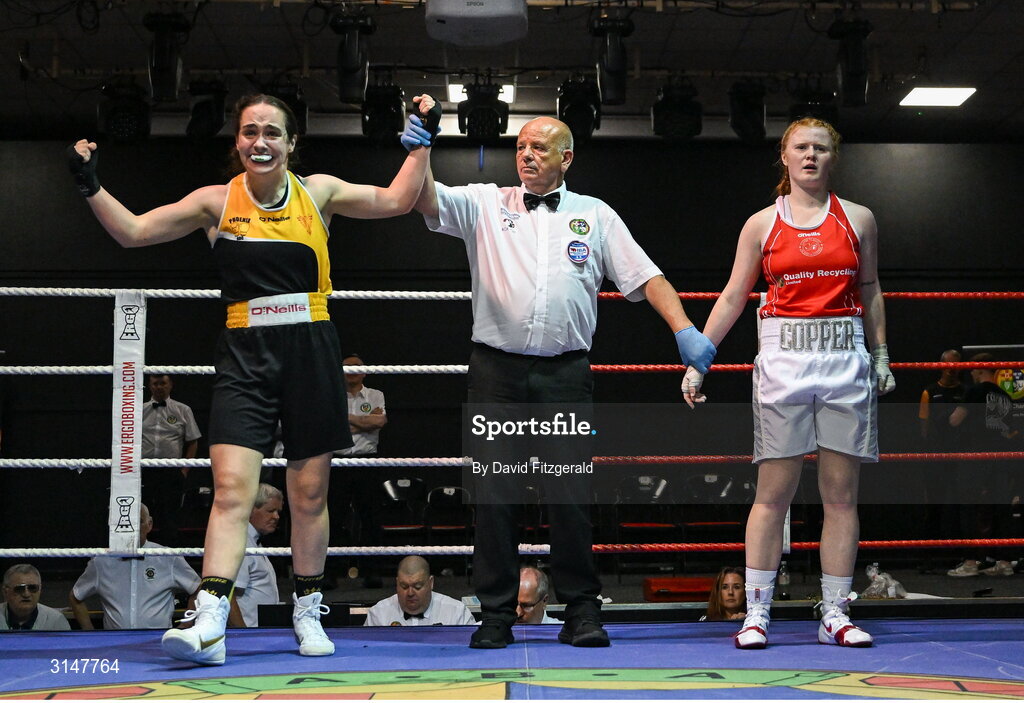 30 May 2025; Cassie Henderson of Phoenix BC, left, celebrates after winning her bout against Kaysie Joyce of Clonmel BC during the 2025 National Senior Cadet Championship Finals at the National Boxing Stadium in Dublin. Photo by David Fitzgerald/Sportsfile
