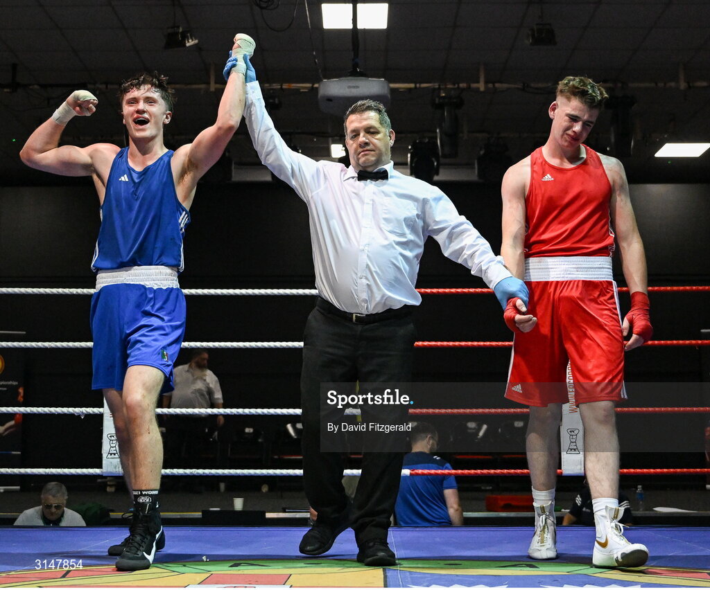 30 May 2025; Senan Kennedy of Cabra BC, left, celebrates after winning his bout against Sean Doohan of Dunfanaghy BC during the 2025 National Senior Cadet Championship Finals at the National Boxing Stadium in Dublin. Photo by David Fitzgerald/Sportsfile