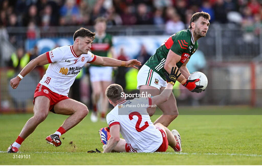 31 May 2025; Aidan O’Shea of Mayo in action against Tyrone players Cormac Quinn, 2, and Michael McKernan during the GAA Football All-Ireland Senior Championship Round 2 match between Tyrone and Mayo at O'Neills Healy Park in Omagh, Tyrone. Photo by Piaras Ó Mídheach/Sportsfile