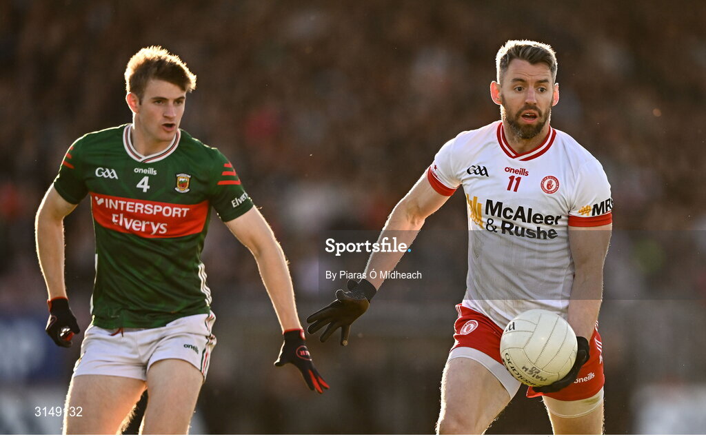 31 May 2025; Mattie Donnelly of Tyrone in action against Rory Brickenden of Mayo during the GAA Football All-Ireland Senior Championship Round 2 match between Tyrone and Mayo at O'Neills Healy Park in Omagh, Tyrone. Photo by Piaras Ó Mídheach/Sportsfile
