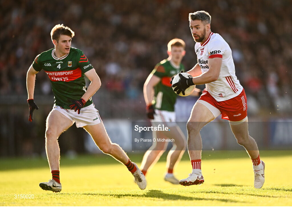 31 May 2025; Mattie Donnelly of Tyrone in action against Rory Brickenden of Mayo during the GAA Football All-Ireland Senior Championship Round 2 match between Tyrone and Mayo at O'Neills Healy Park in Omagh, Tyrone. Photo by Piaras Ó Mídheach/Sportsfile