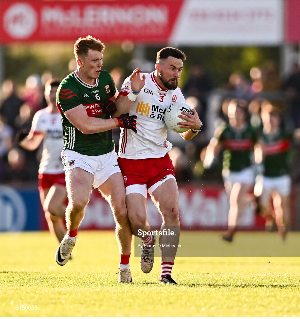 31 May 2025; Peter Teague of Tyrone in action against David McBrien of Mayo during the GAA Football All-Ireland Senior Championship Round 2 match between Tyrone and Mayo at O'Neills Healy Park in Omagh, Tyrone. Photo by Piaras Ó Mídheach/Sportsfile
