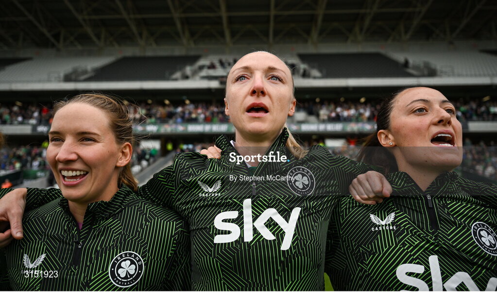 3 June 2025; Republic of Ireland international Louise Quinn, on the occasion of her last international game, stand for the national anthems alongside teammates Sophie Whitehouse and Megan Campbell before the UEFA Women's Nations League, League B match between Republic of Ireland and Slovenia at Páirc Uí Chaoimh in Cork.