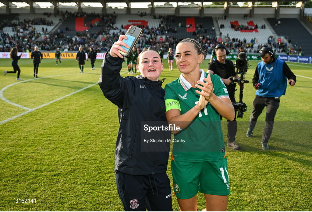 3 June 2025; Republic of Ireland captain Katie McCabe with a supporter after the UEFA Women's Nations League, League B match between Republic of Ireland and Slovenia at Páirc Uí Chaoimh in Cork. Photo by Stephen McCarthy/Sportsfile