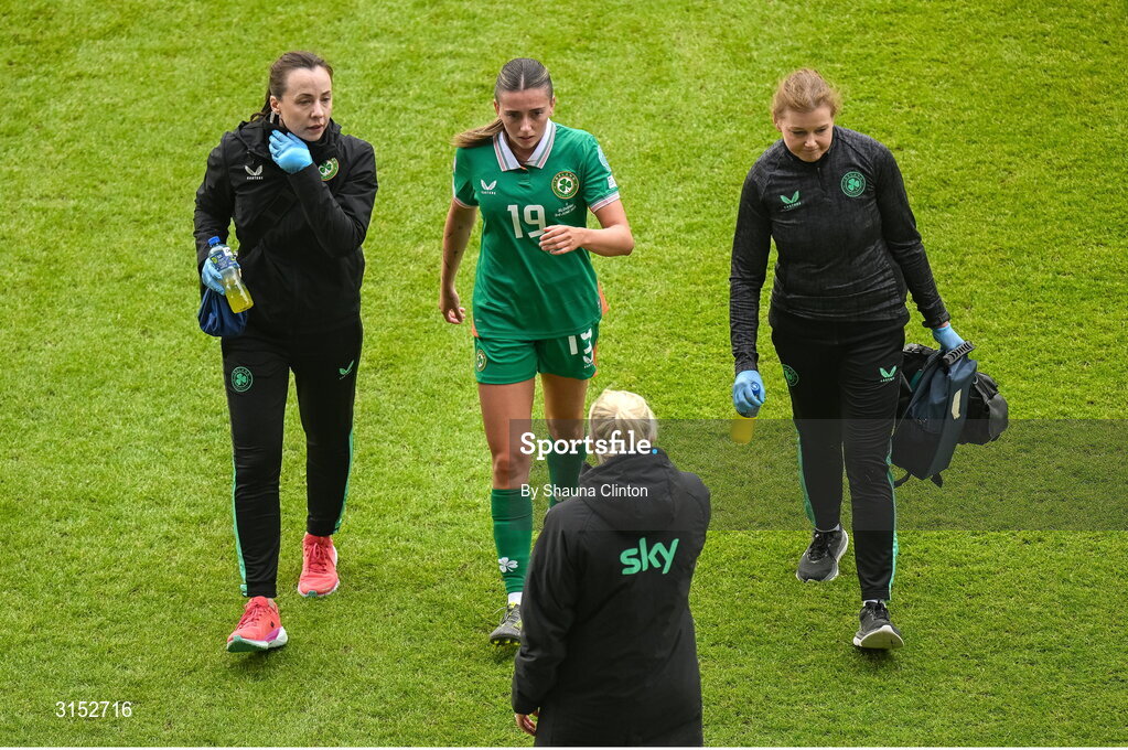 3 June 2025; Abbie Larkin of Republic of Ireland receives medical attention from physiotherapist Angela Kenneally, left, and team doctor Siobhan Forman, right, during the UEFA Women's Nations League, League B match between Republic of Ireland and Slovenia at Páirc Uí Chaoimh in Cork. Photo by Shauna Clinton/Sportsfile