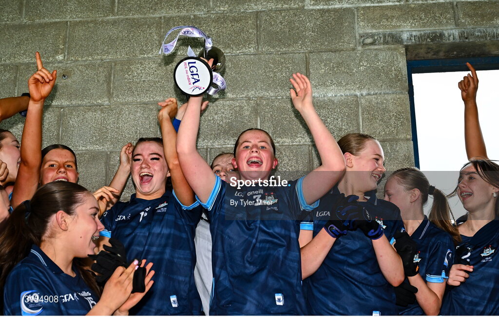 8 June 2025; Dublin captain Maeve Conlon lifts the cup after the LGFA All-Ireland U14 Gold Final match between Dublin and Kerry at Nenagh Éire Óg GAA Club in Nenagh, Tipperary. Photo by Tyler Miller/Sportsfile