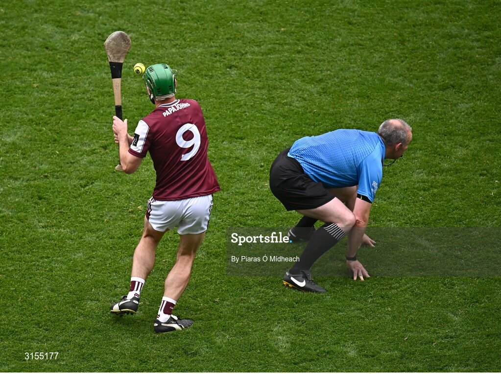8 June 2025; David Burke of Galway makes a pass as referee Johnny Murphy ducks out of the way during the Leinster GAA Senior Hurling Championship final match between Kilkenny and Galway at Croke Park in Dublin. Photo by Piaras Ó Mídheach/Sportsfile