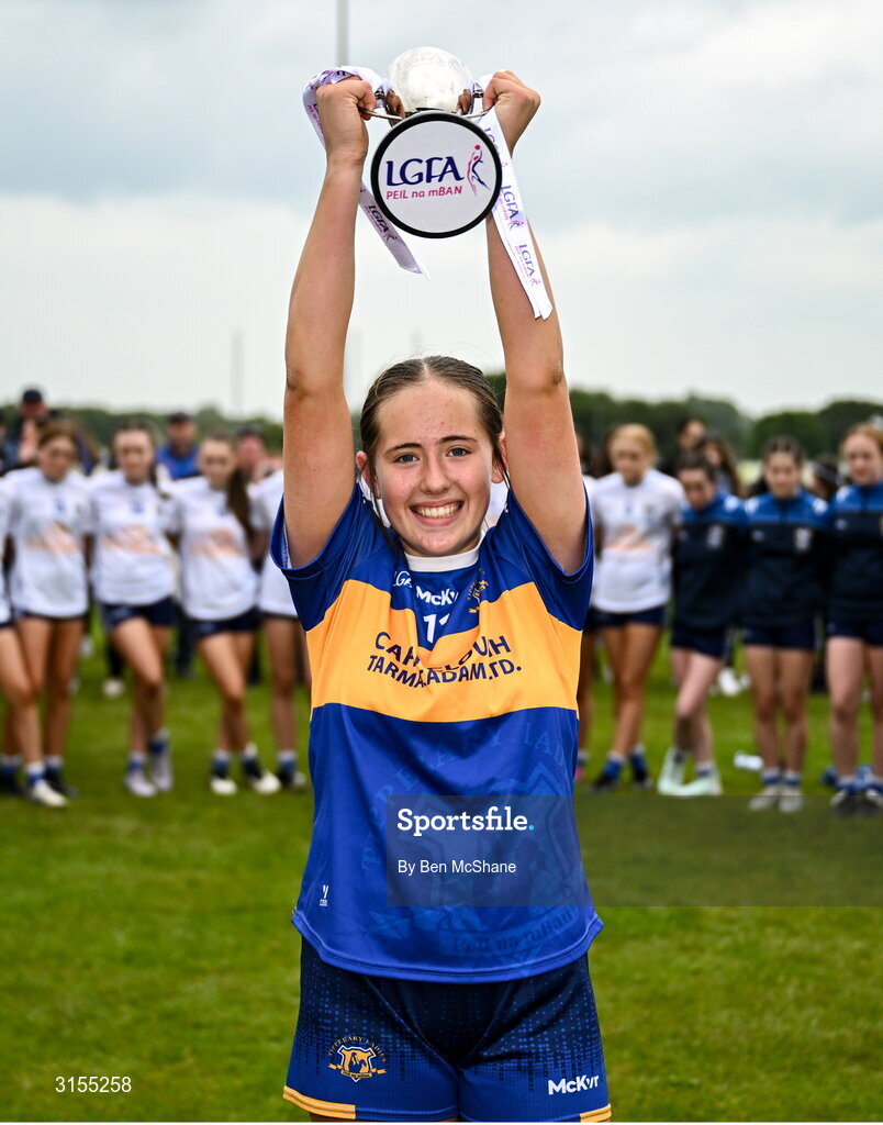 8 June 2025; Tipperary captain Farrah Madigan lifts the cup after the LGFA All-Ireland U14 Silver Final match between Tipperary and Cavan at Coralstown/Kinnegad GAA in Westmeath. Photo by Ben McShane/Sportsfile