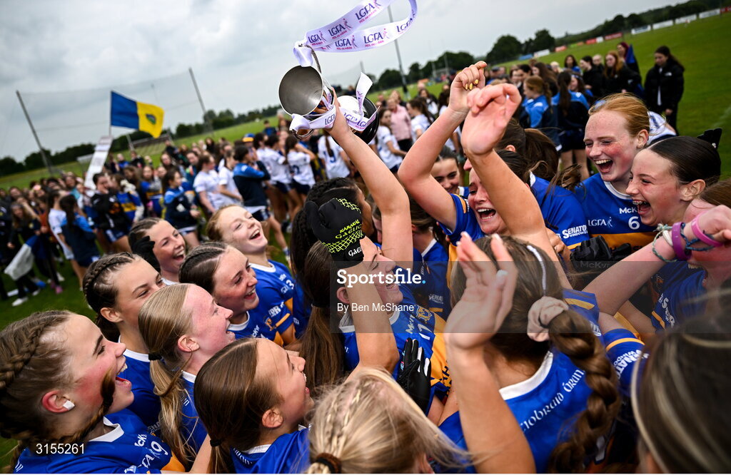 8 June 2025; Tipperary players celebrate with the cup after the LGFA All-Ireland U14 Silver Final match between Tipperary and Cavan at Coralstown/Kinnegad GAA in Westmeath. Photo by Ben McShane/Sportsfile