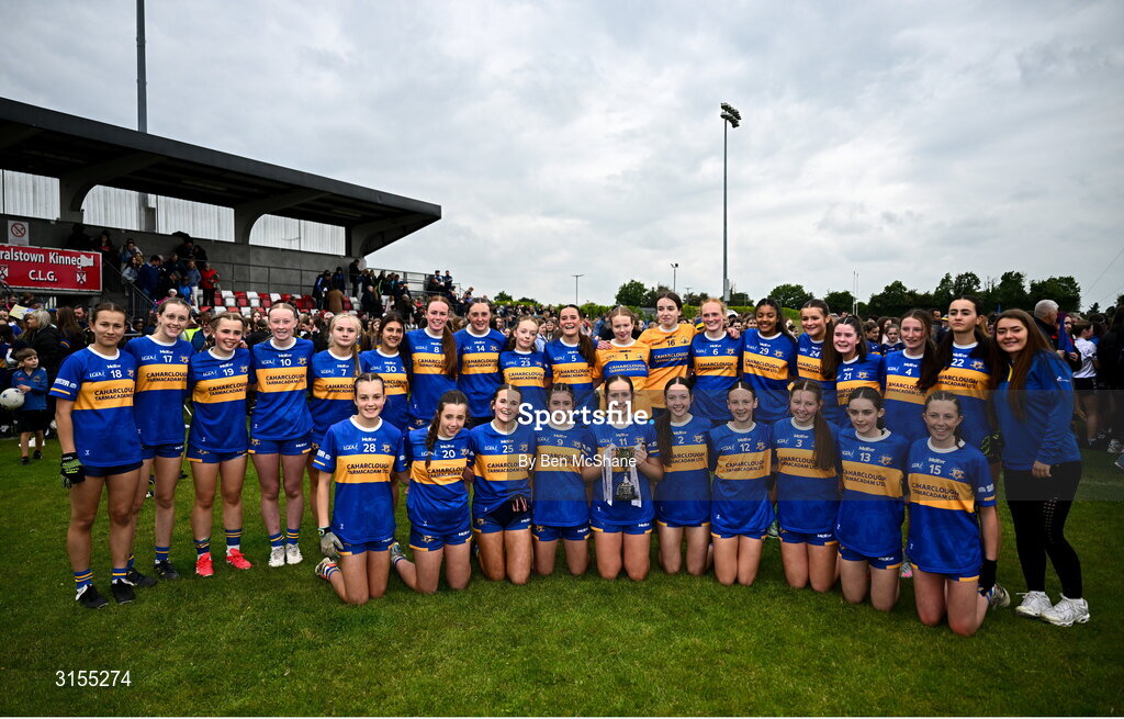 8 June 2025; Tipperary players celebrate with the cup after the LGFA All-Ireland U14 Silver Final match between Tipperary and Cavan at Coralstown/Kinnegad GAA in Westmeath. Photo by Ben McShane/Sportsfile