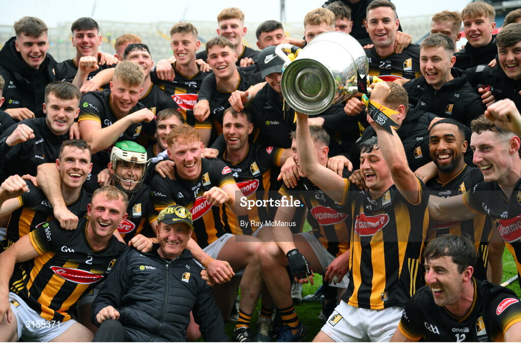 8 June 2025; Cian Kenny, holding the Bob O'Keeffe Cup, kit man Rackard Cody and the Kilkenny players celebrate after the Leinster GAA Senior Hurling Championship final match between Kilkenny and Galway at Croke Park in Dublin. Photo by Ray McManus/Sportsfile