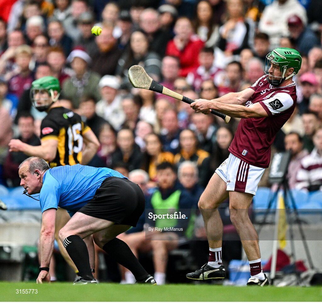 8 June 2025; David Burke of Galway makes a pass as referee Johnny Murphy ducks out of the way during the Leinster GAA Senior Hurling Championship final match between Kilkenny and Galway at Croke Park in Dublin. Photo by Ray McManus/Sportsfile
