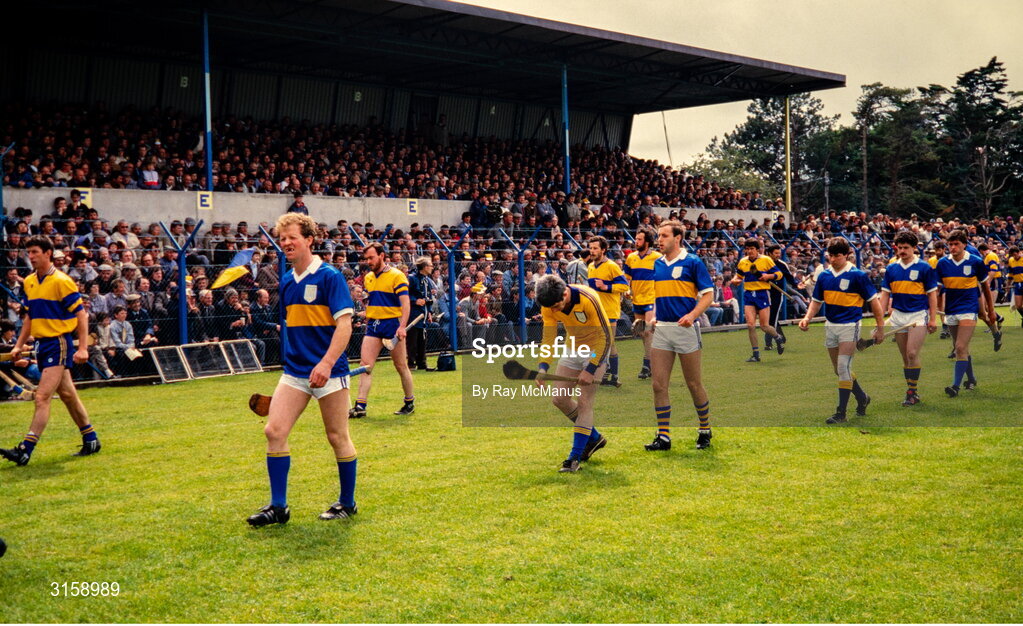 9 June 1985; The Tipperary team, led by captain Jack Bergin, and the Clare team during the parade before the Munster Senior Hurling Championship Semi Final match between Clare and Tipperary at Cusack Park in Ennis, Clare. Photo by Ray McManus/Sportsfile