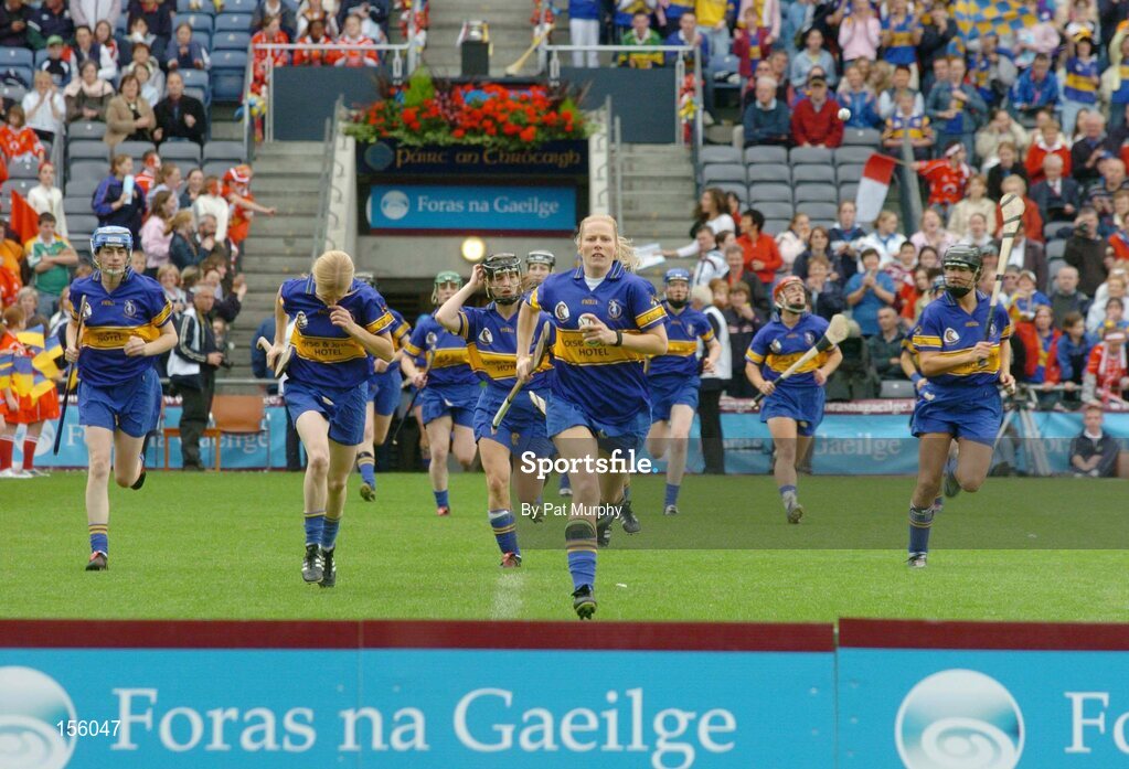19 September 2004; The Tipperary players make their way to the bench for the team photograph. Foras na Gaeilge Senior Camogie Championship All-Ireland Final, Tipperary v Cork, Croke Park, Dublin. Picture credit; Pat Murphy / SPORTSFILE