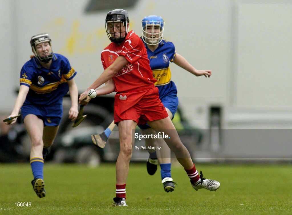 19 September 2004; Gemma O'Connor, Cork, in action against Therese Brophy, left, and Philly Fogarty, Tipperary. Foras na Gaeilge Senior Camogie Championship All-Ireland Final, Tipperary v Cork, Croke Park, Dublin. Picture credit; Pat Murphy / SPORTSFILE