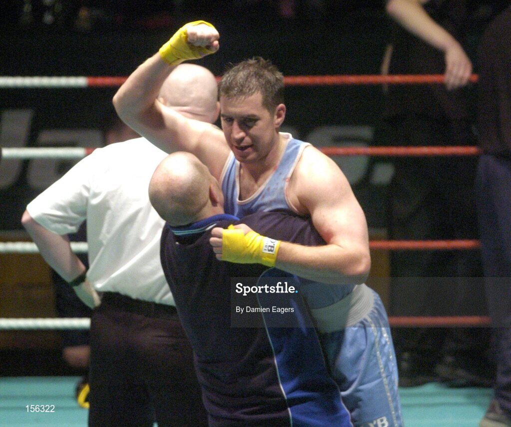 25 September 2004; Jonathan Magee celebrates victory with Michael Carruth. Charity boxing match, Jonathan Magee v Quentin Hann, National Stadium, Dublin. Picture credit; Damien Eagers / SPORTSFILE