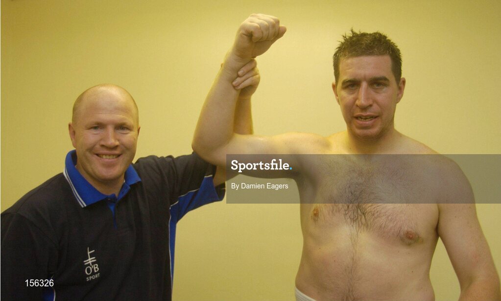 25 September 2004; Jonathan Magee, right, with Michael Carruth after victory over Quentin Hann. Charity boxing match, Jonathan Magee v Quentin Hann, National Stadium, Dublin. Picture credit; Damien Eagers / SPORTSFILE