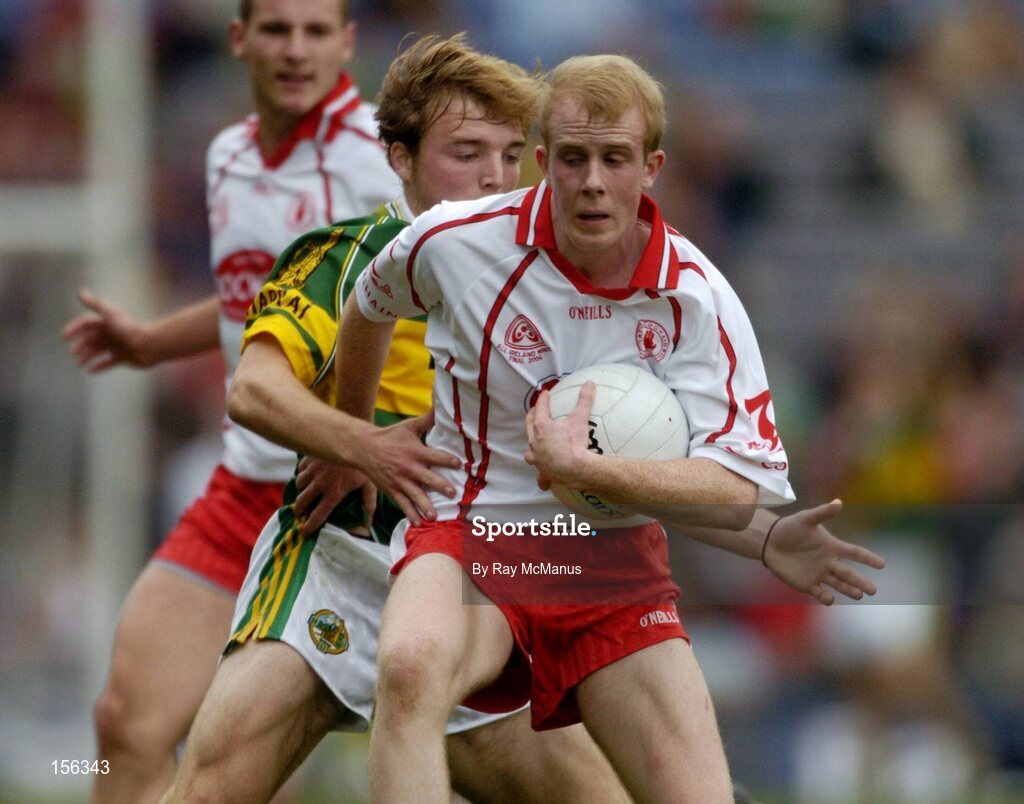 26 September 2004; Martin Murray, Tyrone, in action against Darren O'Sullivan, Mayo. All-Ireland Minor Football Championship Final, Kerry v Tyrone, Croke Park, Dublin. Picture credit; Ray McManus / SPORTSFILE *** Local Caption *** Any photograph taken by SPORTSFILE during, or in connection with, the 2004 All-Ireland Minor Football Final which displays GAA logos or contains an image or part of an image of any GAA intellectual property, or, which contains images of a GAA player/players in their playing uniforms, may only be used for editorial and non-advertising purposes.  Use of photographs for advertising, as posters or for purchase separately is strictly prohibited unless prior written approval has been obtained from the Gaelic Athletic Association.