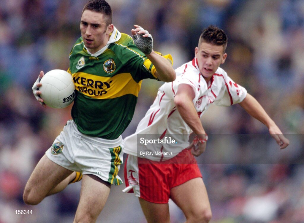 26 September 2004; Brian Moran, Kerry, in action against Niall Kerr, Tyrone. All-Ireland Minor Football Championship Final, Kerry v Tyrone, Croke Park, Dublin. Picture credit; Ray McManus / SPORTSFILE *** Local Caption *** Any photograph taken by SPORTSFILE during, or in connection with, the 2004 All-Ireland Minor Football Final which displays GAA logos or contains an image or part of an image of any GAA intellectual property, or, which contains images of a GAA player/players in their playing uniforms, may only be used for editorial and non-advertising purposes.  Use of photographs for advertising, as posters or for purchase separately is strictly prohibited unless prior written approval has been obtained from the Gaelic Athletic Association.