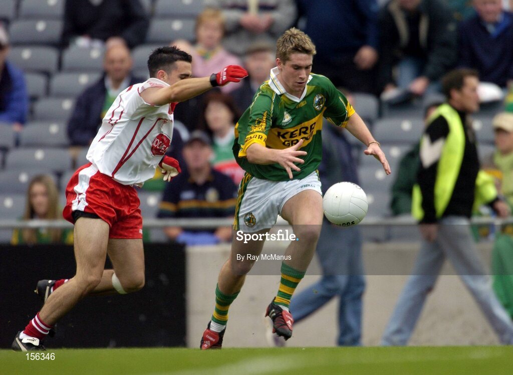 26 September 2004; Paul O'Connor, Kerry, in action against Niall Gilmore, Tyrone. All-Ireland Minor Football Championship Final, Kerry v Tyrone, Croke Park, Dublin. Picture credit; Ray McManus / SPORTSFILE *** Local Caption *** Any photograph taken by SPORTSFILE during, or in connection with, the 2004 All-Ireland Minor Football Final which displays GAA logos or contains an image or part of an image of any GAA intellectual property, or, which contains images of a GAA player/players in their playing uniforms, may only be used for editorial and non-advertising purposes.  Use of photographs for advertising, as posters or for purchase separately is strictly prohibited unless prior written approval has been obtained from the Gaelic Athletic Association.