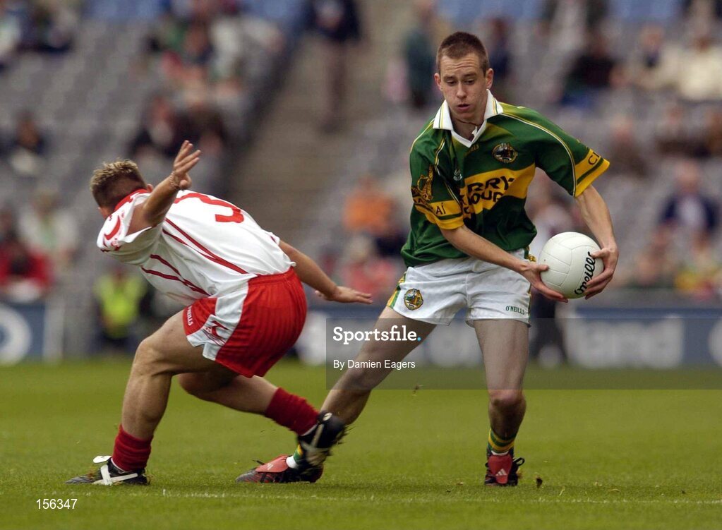 26 September 2004; Michael O'Donoghue, Kerry, in action against Paul Marlow, Tyrone. All-Ireland Minor Football Championship Final, Kerry v Tyrone, Croke Park, Dublin. Picture credit; Damien Eagers / SPORTSFILE *** Local Caption *** Any photograph taken by SPORTSFILE during, or in connection with, the 2004 All-Ireland Minor  Football Final which displays GAA logos or contains an image or part of an image of any GAA intellectual property, or, which contains images of a GAA player/players in their playing uniforms, may only be used for editorial and non-advertising purposes.  Use of photographs for advertising, as posters or for purchase separately is strictly prohibited unless prior written approval has been obtained from the Gaelic Athletic Association.