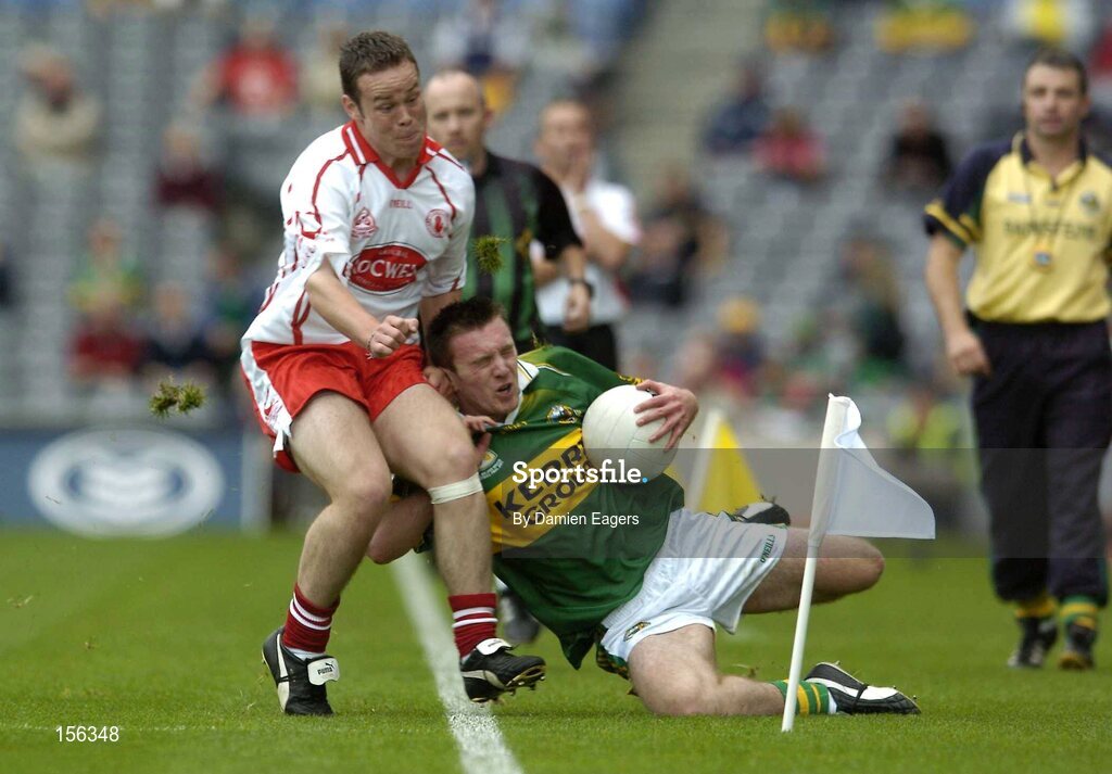 26 September 2004; Mark Evans, Kerry, in action against Damian Burke, Tyrone. All-Ireland Minor Football Championship Final, Kerry v Tyrone, Croke Park, Dublin. Picture credit; Damien Eagers / SPORTSFILE *** Local Caption *** Any photograph taken by SPORTSFILE during, or in connection with, the 2004 All-Ireland Minor  Football Final which displays GAA logos or contains an image or part of an image of any GAA intellectual property, or, which contains images of a GAA player/players in their playing uniforms, may only be used for editorial and non-advertising purposes.  Use of photographs for advertising, as posters or for purchase separately is strictly prohibited unless prior written approval has been obtained from the Gaelic Athletic Association.