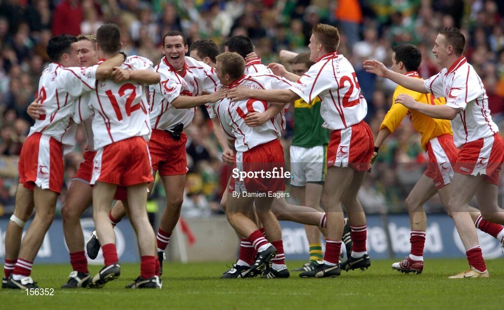 26 September 2004; Tyrone players celebrate after victory over Kerry. All-Ireland Minor Football Championship Final, Kerry v Tyrone, Croke Park, Dublin. Picture credit; Damien Eagers / SPORTSFILE *** Local Caption *** Any photograph taken by SPORTSFILE during, or in connection with, the 2004 All-Ireland Minor  Football Final which displays GAA logos or contains an image or part of an image of any GAA intellectual property, or, which contains images of a GAA player/players in their playing uniforms, may only be used for editorial and non-advertising purposes.  Use of photographs for advertising, as posters or for purchase separately is strictly prohibited unless prior written approval has been obtained from the Gaelic Athletic Association.
