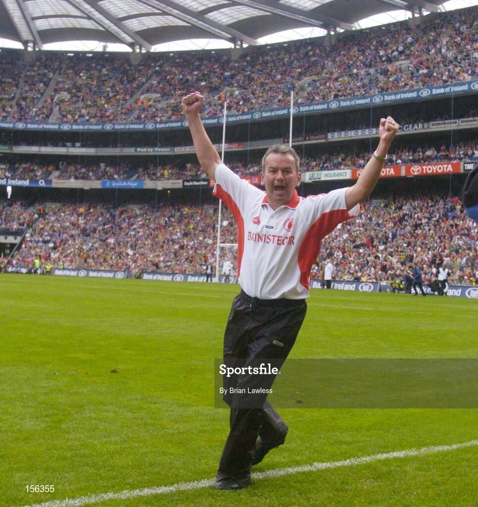 26 September 2004; Tyrone manager Liam Doyle celebrates at the final whistle. All-Ireland Minor Football Championship Final, Kerry v Tyrone, Croke Park, Dublin. Picture credit; Brian Lawless / SPORTSFILE *** Local Caption *** Any photograph taken by SPORTSFILE during, or in connection with, the 2004 All-Ireland Minor Football Final which displays GAA logos or contains an image or part of an image of any GAA intellectual property, or, which contains images of a GAA player/players in their playing uniforms, may only be used for editorial and non-advertising purposes.  Use of photographs for advertising, as posters or for purchase separately is strictly prohibited unless prior written approval has been obtained from the Gaelic Athletic Association.