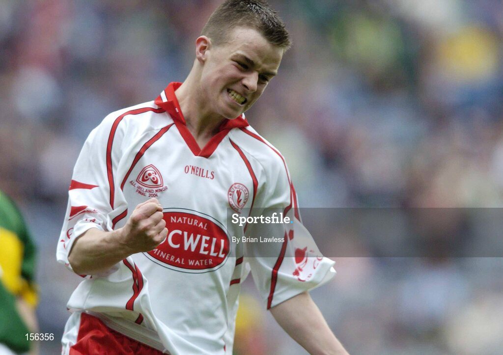 26 September 2004; Ronan McCrory, Tyrone, celebrates a point against Kerry. All-Ireland Minor Football Championship Final, Kerry v Tyrone, Croke Park, Dublin. Picture credit; Brian Lawless / SPORTSFILE *** Local Caption *** Any photograph taken by SPORTSFILE during, or in connection with, the 2004 All-Ireland Minor Football Final which displays GAA logos or contains an image or part of an image of any GAA intellectual property, or, which contains images of a GAA player/players in their playing uniforms, may only be used for editorial and non-advertising purposes.  Use of photographs for advertising, as posters or for purchase separately is strictly prohibited unless prior written approval has been obtained from the Gaelic Athletic Association.