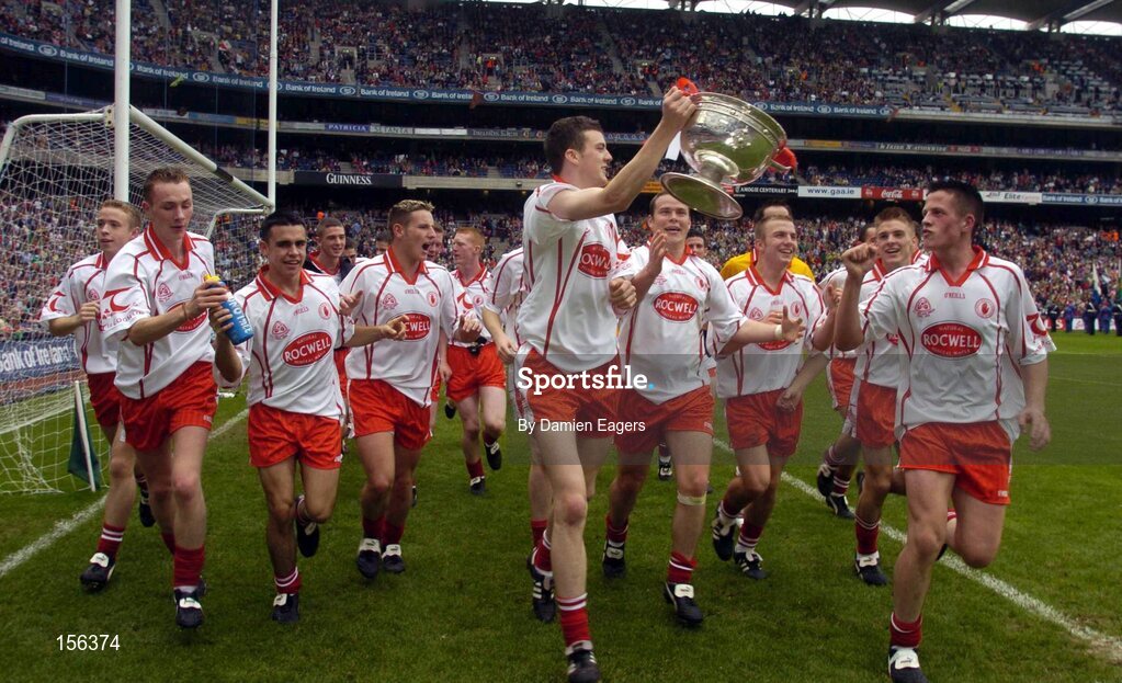 26 September 2004; The Tyrone team celebrate after victory over Kerry. All-Ireland Minor Football Championship Final, Kerry v Tyrone, Croke Park, Dublin. Picture credit; Damien Eagers / SPORTSFILE *** Local Caption *** Any photograph taken by SPORTSFILE during, or in connection with, the 2004 All-Ireland Minor  Football Final which displays GAA logos or contains an image or part of an image of any GAA intellectual property, or, which contains images of a GAA player/players in their playing uniforms, may only be used for editorial and non-advertising purposes.  Use of photographs for advertising, as posters or for purchase separately is strictly prohibited unless prior written approval has been obtained from the Gaelic Athletic Association.