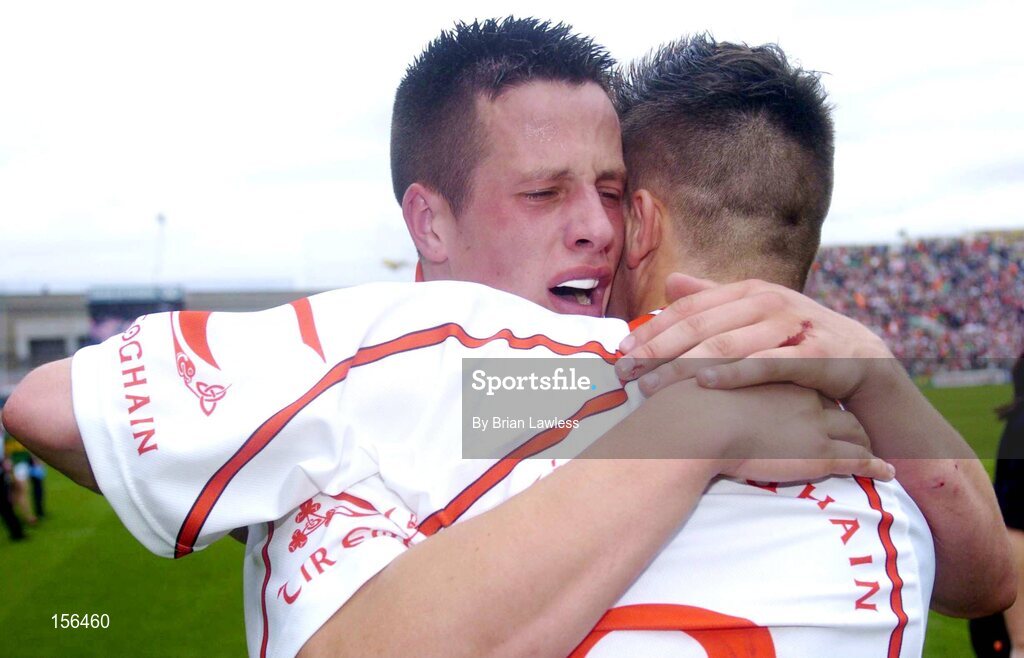 26 September 2004; Tyrone's Shane O'Hagan, left, celebrates with team-mate Niall Kerr after victory over Kerry. All-Ireland Minor Football Championship Final, Kerry v Tyrone, Croke Park, Dublin. Picture credit; Brian Lawless / SPORTSFILE *** Local Caption *** Any photograph taken by SPORTSFILE during, or in connection with, the 2004 All-Ireland Minor Football Final which displays GAA logos or contains an image or part of an image of any GAA intellectual property, or, which contains images of a GAA player/players in their playing uniforms, may only be used for editorial and non-advertising purposes.  Use of photographs for advertising, as posters or for purchase separately is strictly prohibited unless prior written approval has been obtained from the Gaelic Athletic Association.