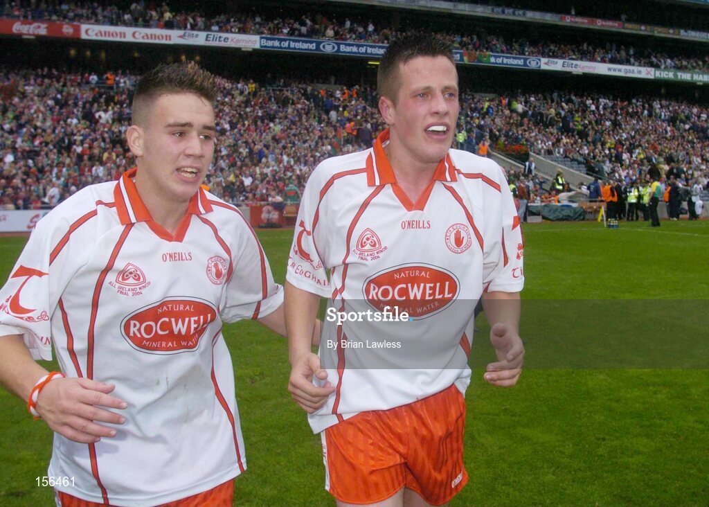 26 September 2004; Tyrone's Niall Kerr, left, and Shane O'Hagan show their emotions after victory over Kerry. All-Ireland Minor Football Championship Final, Kerry v Tyrone, Croke Park, Dublin. Picture credit; Brian Lawless / SPORTSFILE *** Local Caption *** Any photograph taken by SPORTSFILE during, or in connection with, the 2004 All-Ireland Minor Football Final which displays GAA logos or contains an image or part of an image of any GAA intellectual property, or, which contains images of a GAA player/players in their playing uniforms, may only be used for editorial and non-advertising purposes.  Use of photographs for advertising, as posters or for purchase separately is strictly prohibited unless prior written approval has been obtained from the Gaelic Athletic Association.