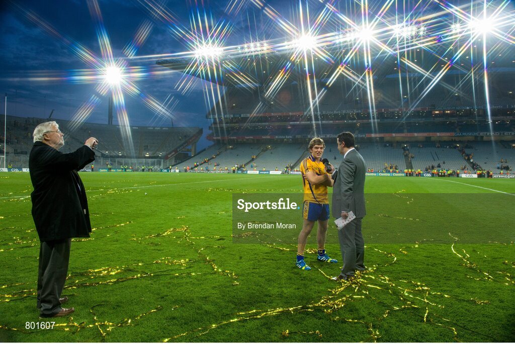 28 September 2013; Martin Collins, left, photographs his son, broadcaster Paul Collins, as he interviews Clare hurler Shane O'Donnell after the game. GAA Hurling All-Ireland Senior Championship Final Replay, Cork v Clare, Croke Park, Dublin. Picture credit: Brendan Moran / SPORTSFILE