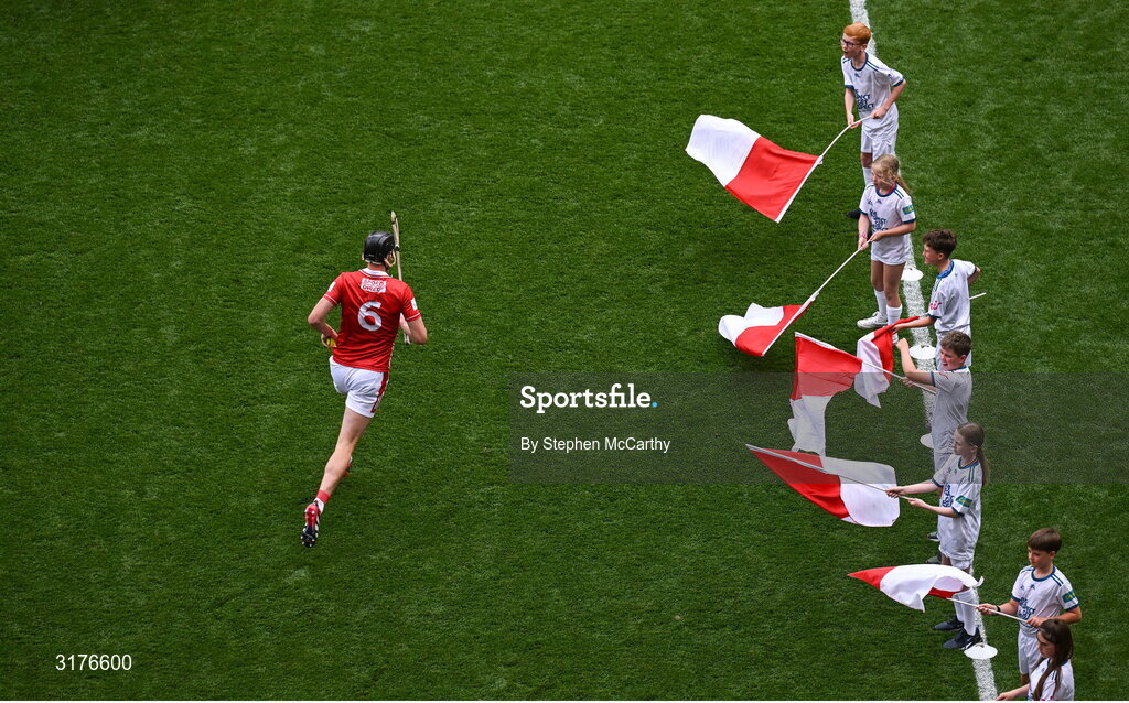 5 July 2025; Cork captain Robert Downey leads his side out for the GAA Hurling All-Ireland Senior Championship semi-final match between Cork and Dublin at Croke Park in Dublin. Photo by Stephen McCarthy/Sportsfile