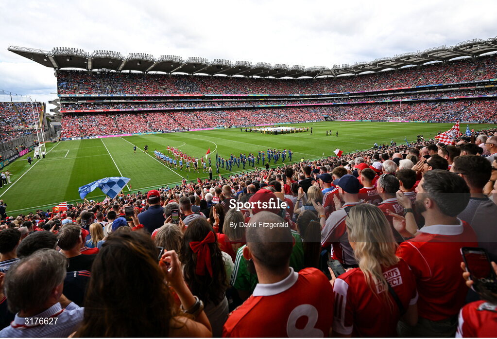 5 July 2025; Players from both sides march behind the band before the GAA Hurling All-Ireland Senior Championship semi-final match between Cork and Dublin at Croke Park in Dublin. Photo by David Fitzgerald/Sportsfile