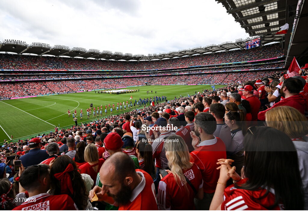 5 July 2025; Players from both sides march behind the band before the GAA Hurling All-Ireland Senior Championship semi-final match between Cork and Dublin at Croke Park in Dublin. Photo by David Fitzgerald/Sportsfile