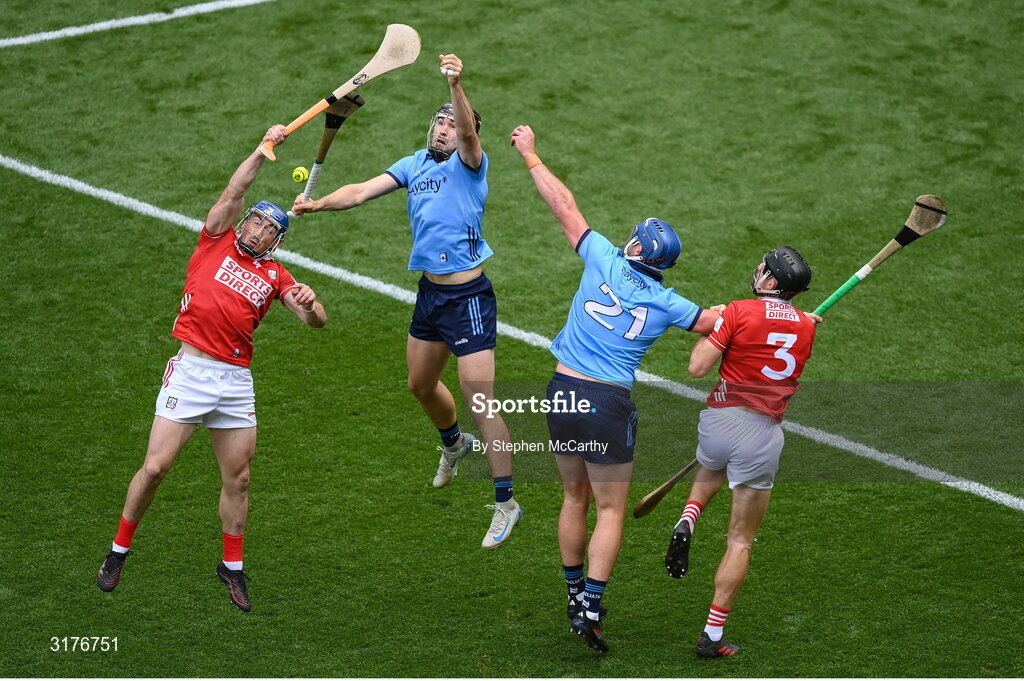 5 July 2025; Seán O'Donoghue, left, and Eoin Downey of Cork in action against Ronan Hayes and John Hetherton, right, of Dublin during the GAA Hurling All-Ireland Senior Championship semi-final match between Cork and Dublin at Croke Park in Dublin. Photo by Stephen McCarthy/Sportsfile
