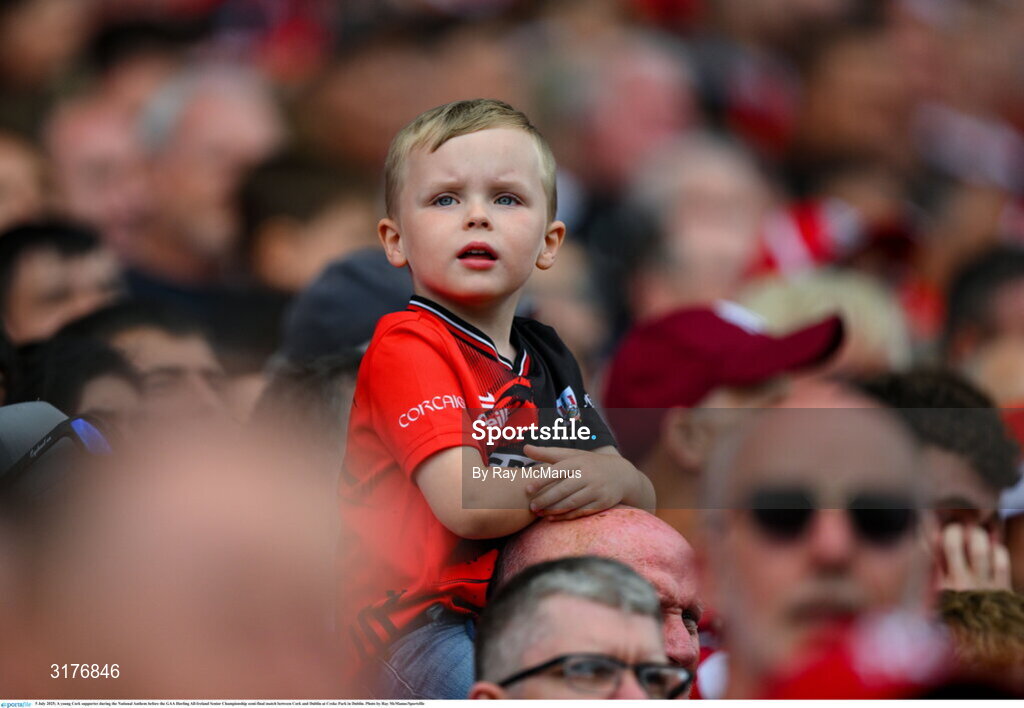 5 July 2025; A young Cork supporter during the National Anthem before the GAA Hurling All-Ireland Senior Championship semi-final match between Cork and Dublin at Croke Park in Dublin. Photo by Ray McManus/Sportsfile