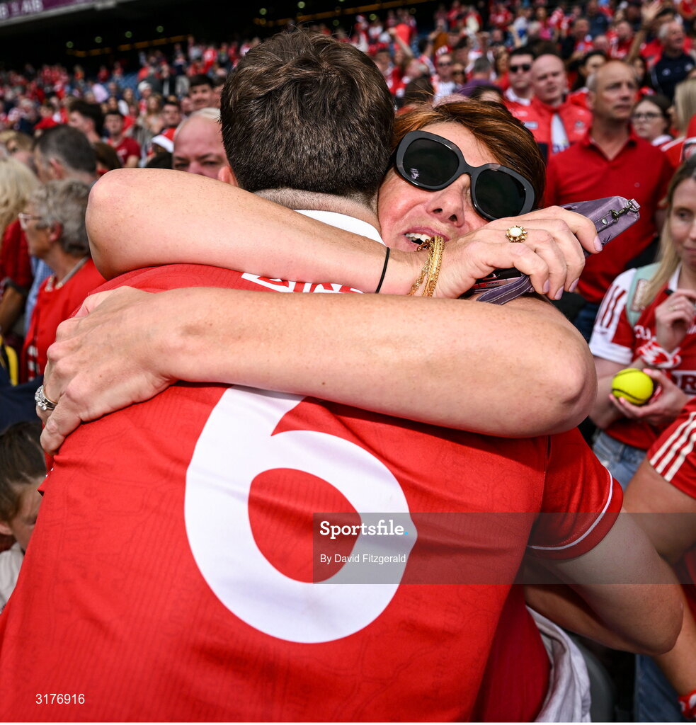 5 July 2025; Robert Downey of Cork celebrates with his mother Angela after the GAA Hurling All-Ireland Senior Championship semi-final match between Cork and Dublin at Croke Park in Dublin. Photo by David Fitzgerald/Sportsfile