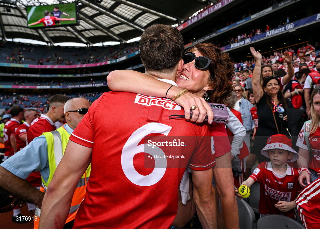 5 July 2025; Robert Downey of Cork celebrates with his mother Angela after the GAA Hurling All-Ireland Senior Championship semi-final match between Cork and Dublin at Croke Park in Dublin. Photo by David Fitzgerald/Sportsfile