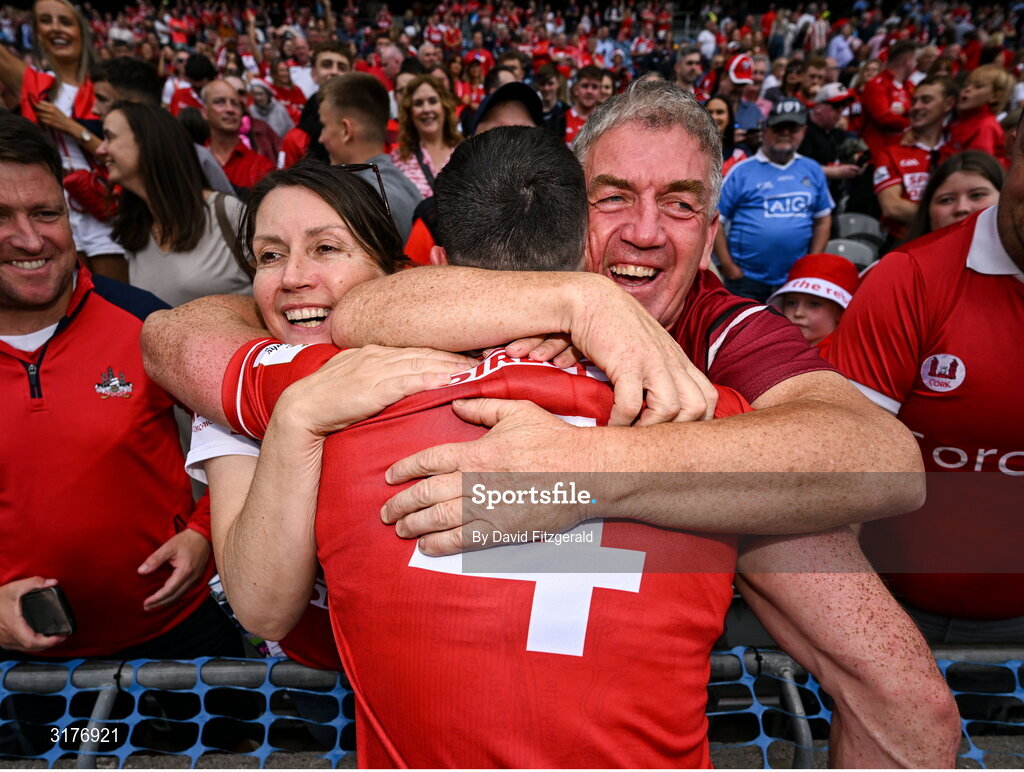 5 July 2025; Seán O'Donoghue of Cork celebrates with his parents Paddy and Yvonne after the GAA Hurling All-Ireland Senior Championship semi-final match between Cork and Dublin at Croke Park in Dublin. Photo by David Fitzgerald/Sportsfile