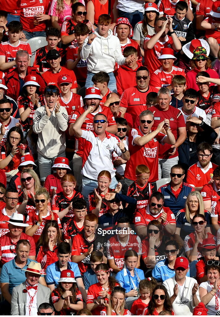5 July 2025; Cork supporters in the Cusack Stand celebrate a score during the GAA Hurling All-Ireland Senior Championship semi-final match between Cork and Dublin at Croke Park in Dublin. Photo by Stephen McCarthy/Sportsfile
