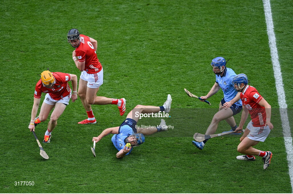 5 July 2025; Riain McBride with the support of his Dublin team-mate Conor Burke, right, in action against Shane Barrett, left, Darragh Fitzgibbon, 9, and Diarmuid Healy of Cork during the GAA Hurling All-Ireland Senior Championship semi-final match between Cork and Dublin at Croke Park in Dublin. Photo by Stephen McCarthy/Sportsfile