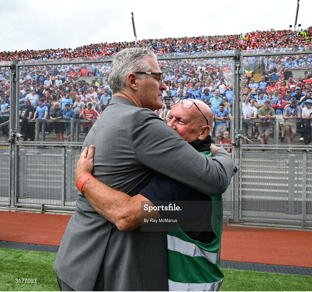 5 July 2025; Irish Examiner photographer Eddie O'Hare, who retired after today's game having served the paper for more than 47 years, is photographed with the Uachtarán Chumann Lúthchleas Gael Jarlath Burns before the GAA Hurling All-Ireland Senior Championship semi-final match between Cork and Dublin at Croke Park in Dublin. Photo by Ray McManus/Sportsfile