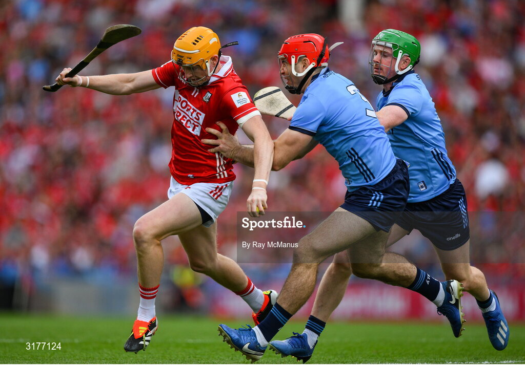 5 July 2025; Shane Barrett of Cork in action against Paddy Smyth, 3, and Conor McHugh of Dublin during the GAA Hurling All-Ireland Senior Championship semi-final match between Cork and Dublin at Croke Park in Dublin. Photo by Ray McManus/Sportsfile